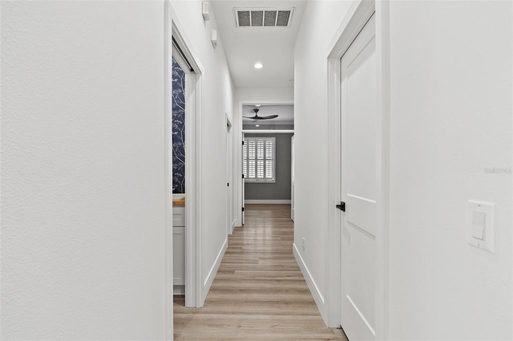 11627 Renaissance View Court Tampa, FL 33626 - Photo 55 of 62 a view of a hallway with wooden floor and entryway