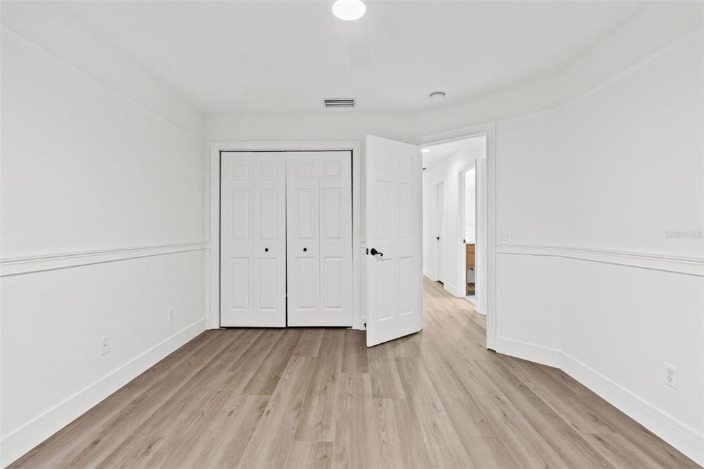 11627 Renaissance View Court Tampa, FL 33626 - Photo 59 of 62 a view of a room with wooden floor