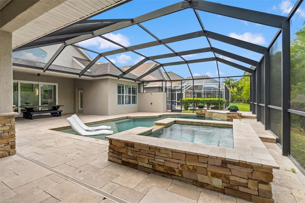 11627 Renaissance View Court Tampa, FL 33626 - Photo 62 of 62 a view of a patio with a table and chairs under an umbrella