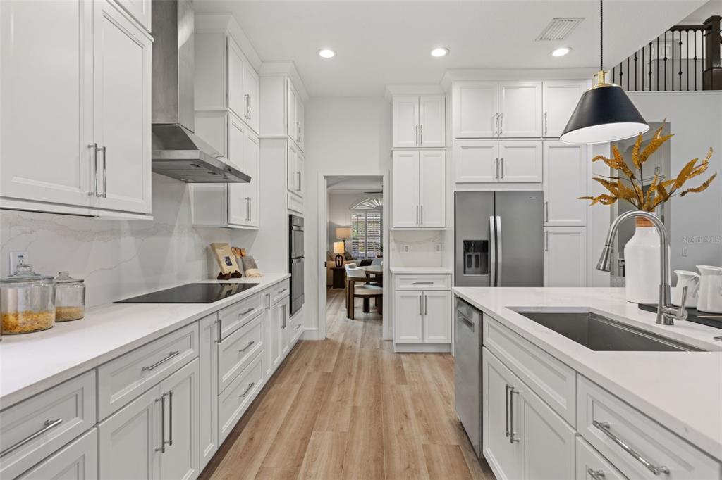 11627 Renaissance View Court Tampa, FL 33626 - Photo 7 of 62 a kitchen with stainless steel appliances granite countertop a sink a stove and a refrigerator