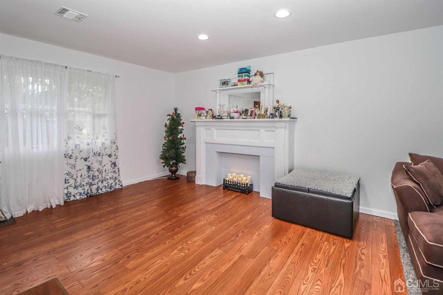 10 Matson Road Edison, NJ 08817 - Photo 7 of 40 a living room with furniture and a fireplace