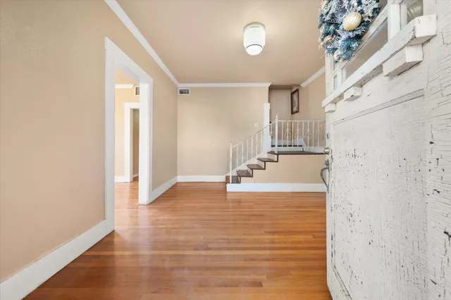 a view of a kitchen with a sink and cabinets