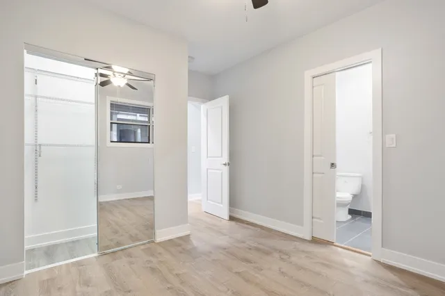 a view of an empty room with a bathroom