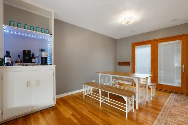 a bedroom with furniture and wooden floor