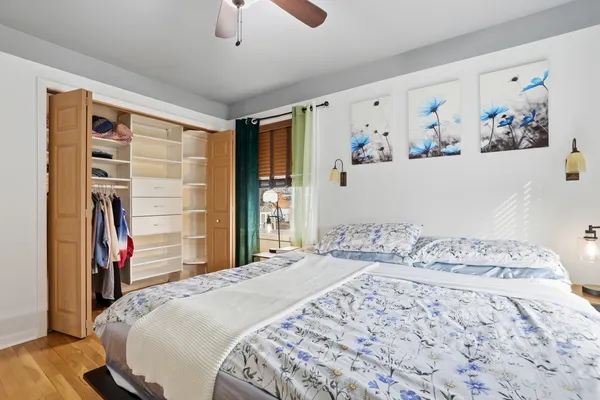 a bedroom with a bed and a walk in closet