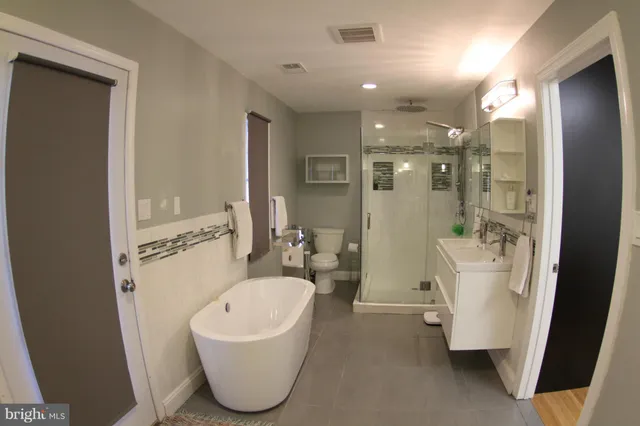 a view of a chairs and table in the patio