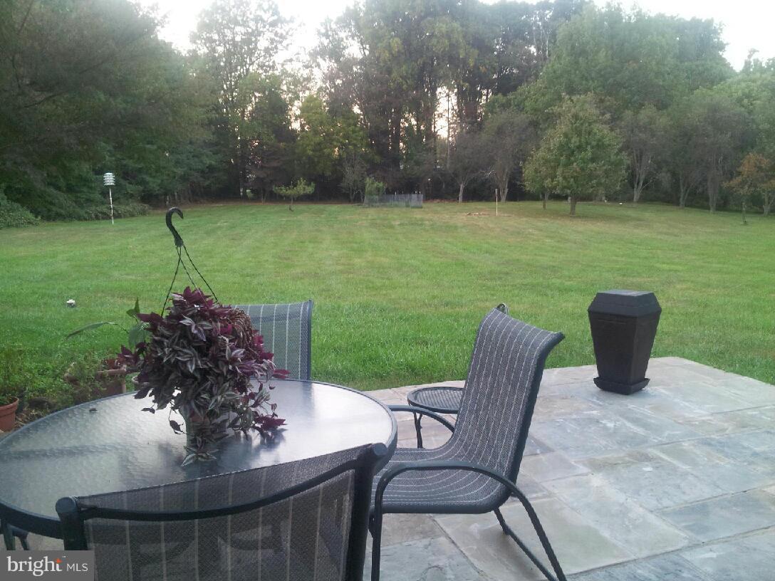 1542 Crowell Road Vienna, VA 22182 - Photo 14 of 55 a view of a chairs and table in the patio