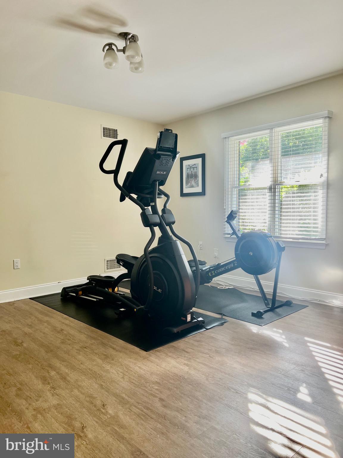 1542 Crowell Road Vienna, VA 22182 - Photo 22 of 55 a room with gym equipment and a window