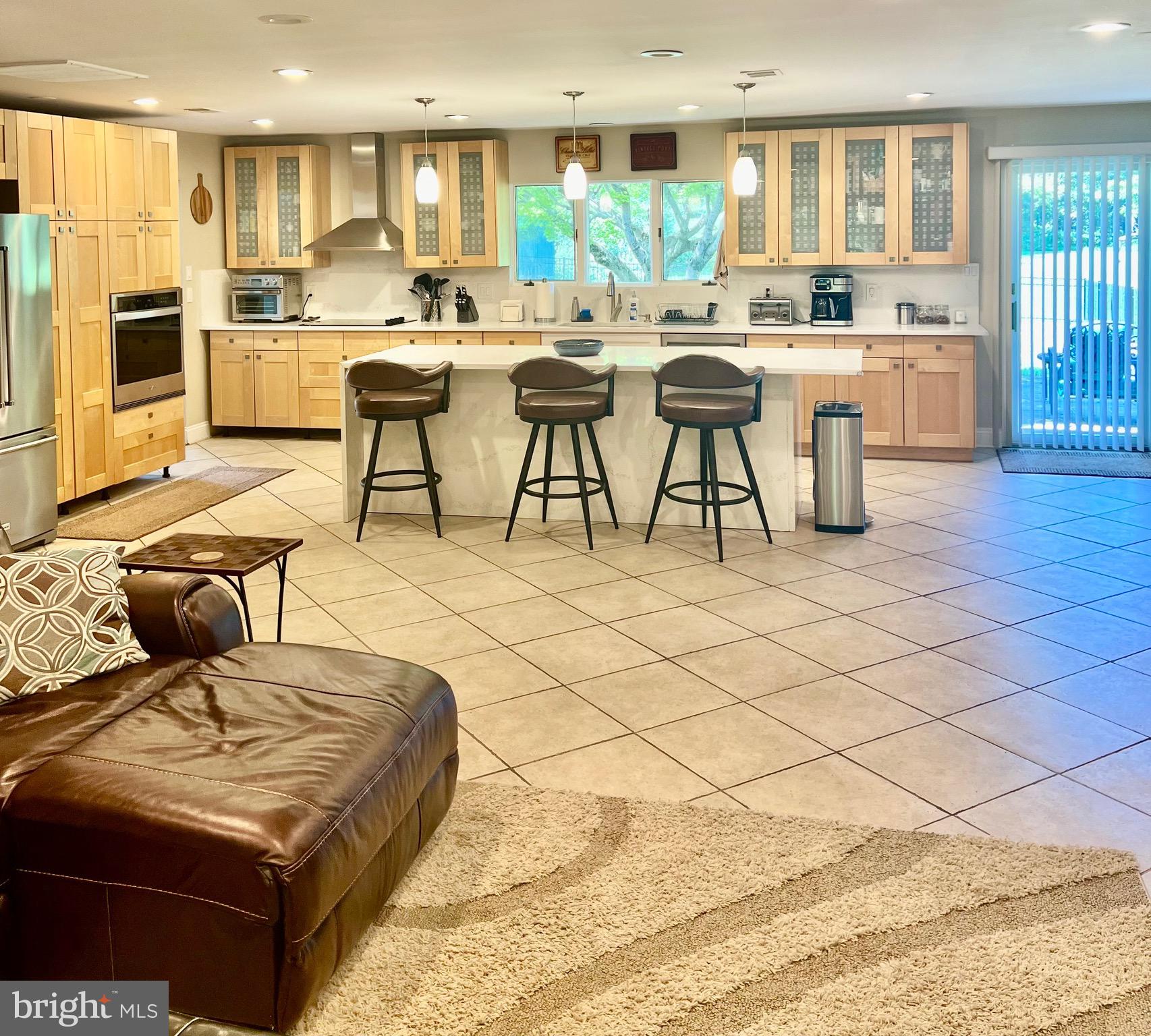 1542 Crowell Road Vienna, VA 22182 - Photo 26 of 55 a living room with furniture and a large window