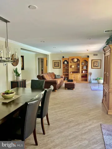 a spacious bathroom with a tub a sink and mirror