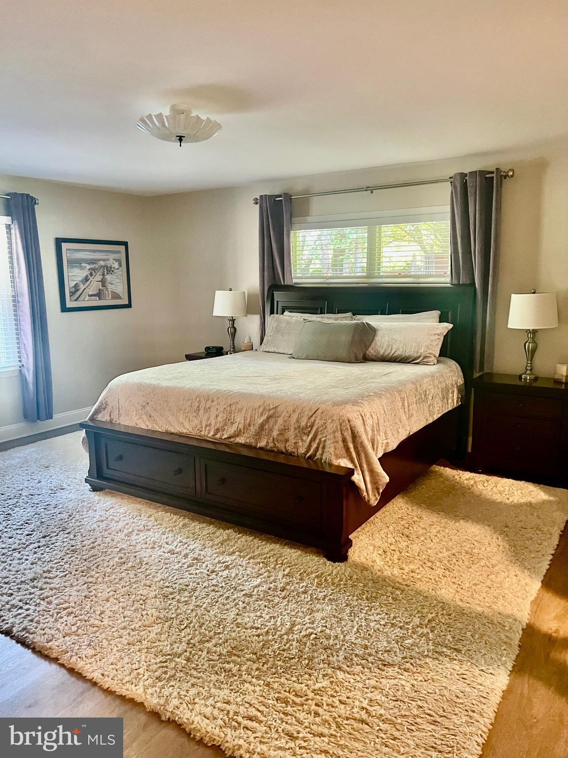 1542 Crowell Road Vienna, VA 22182 - Photo 31 of 55 a bedroom with a bed and wooden floor