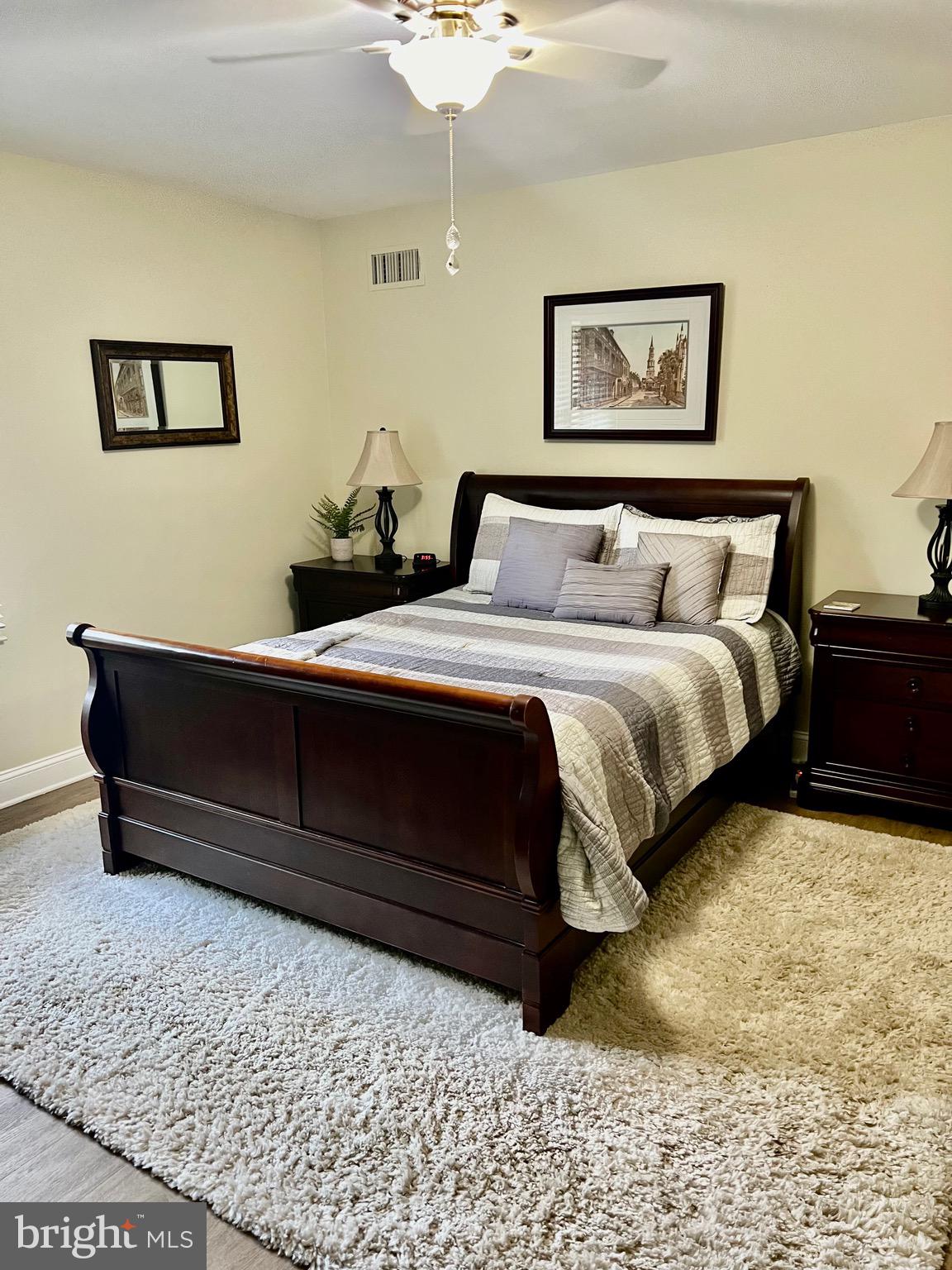 1542 Crowell Road Vienna, VA 22182 - Photo 38 of 55 a bedroom with a bed and a chandelier