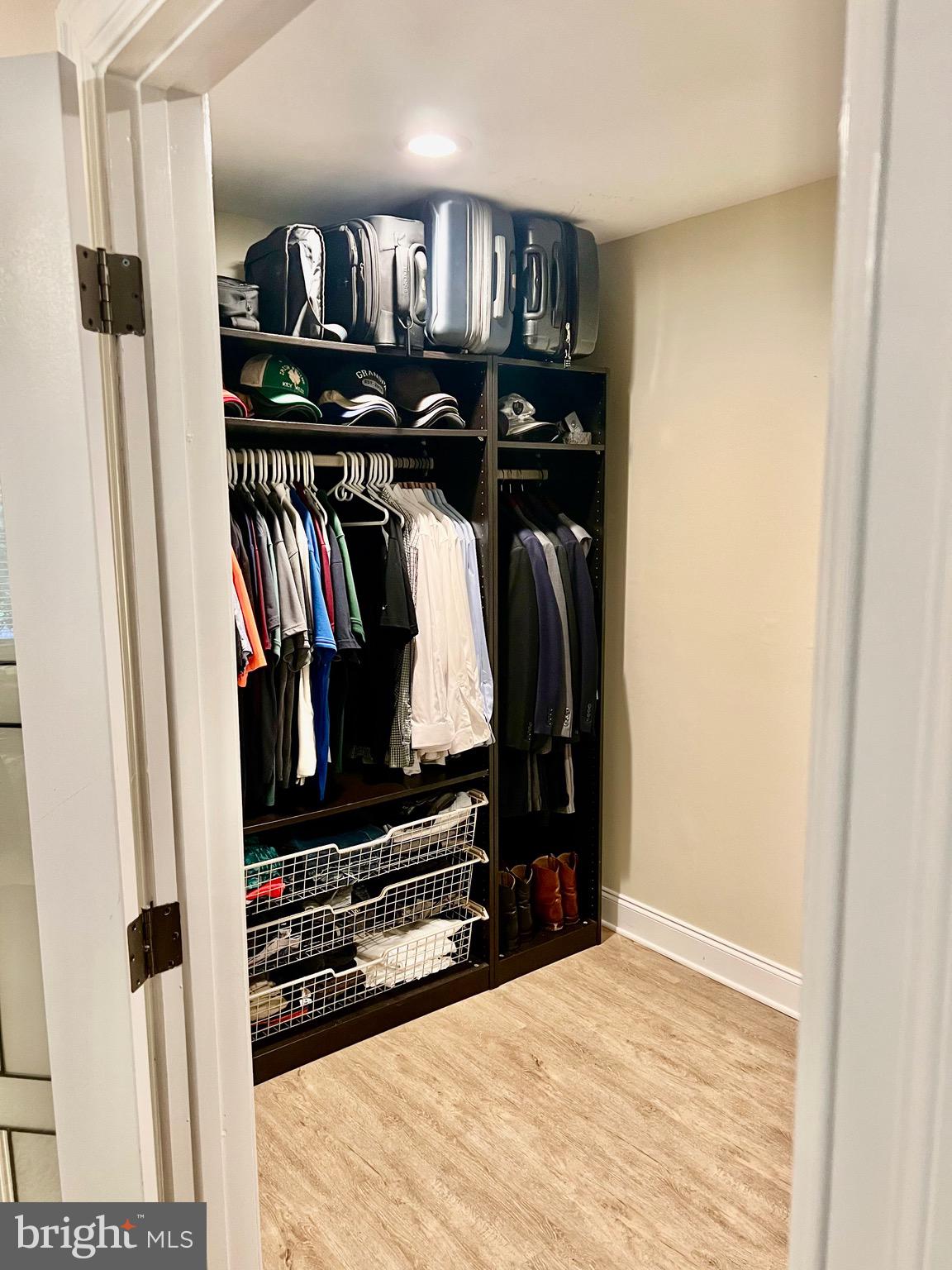 1542 Crowell Road Vienna, VA 22182 - Photo 42 of 55 a view of walk in closet with clothes and shoes