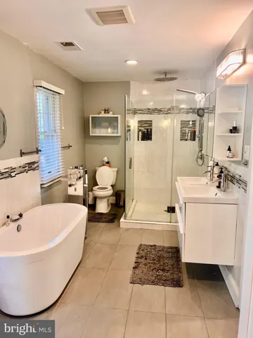 a view of swimming pool outdoor seating and city view