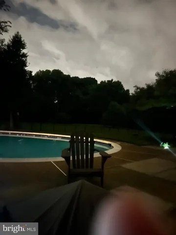 a view of a patio with table and chairs and potted plants