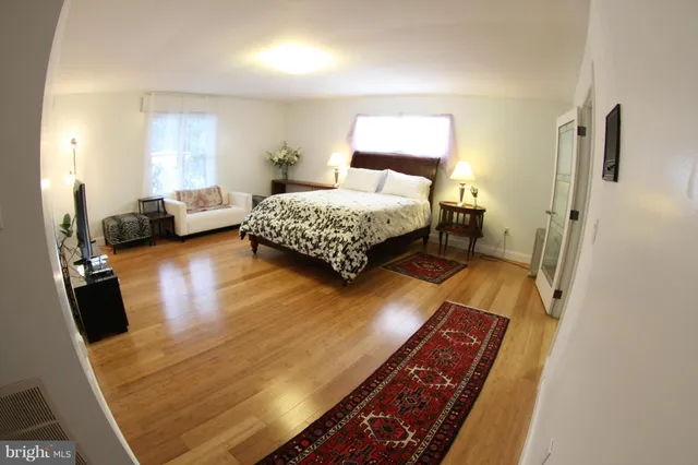 a white bath tub sitting in a bathroom and shower