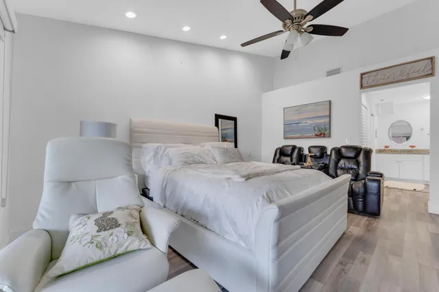 a bed room with a bed and a chandelier