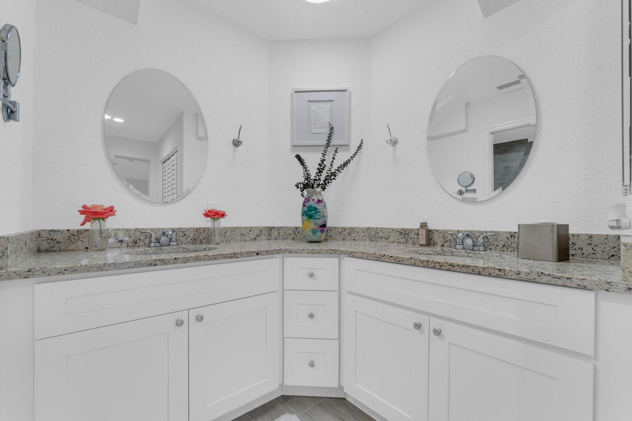 11120 Sangria Court Boca Raton, FL 33498 - Photo 16 of 34 a bathroom with a granite countertop sink and a mirror