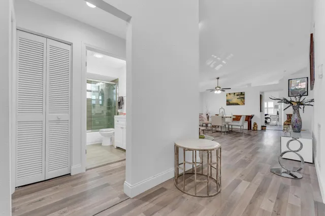 a view of a livingroom with furniture and hardwood floor