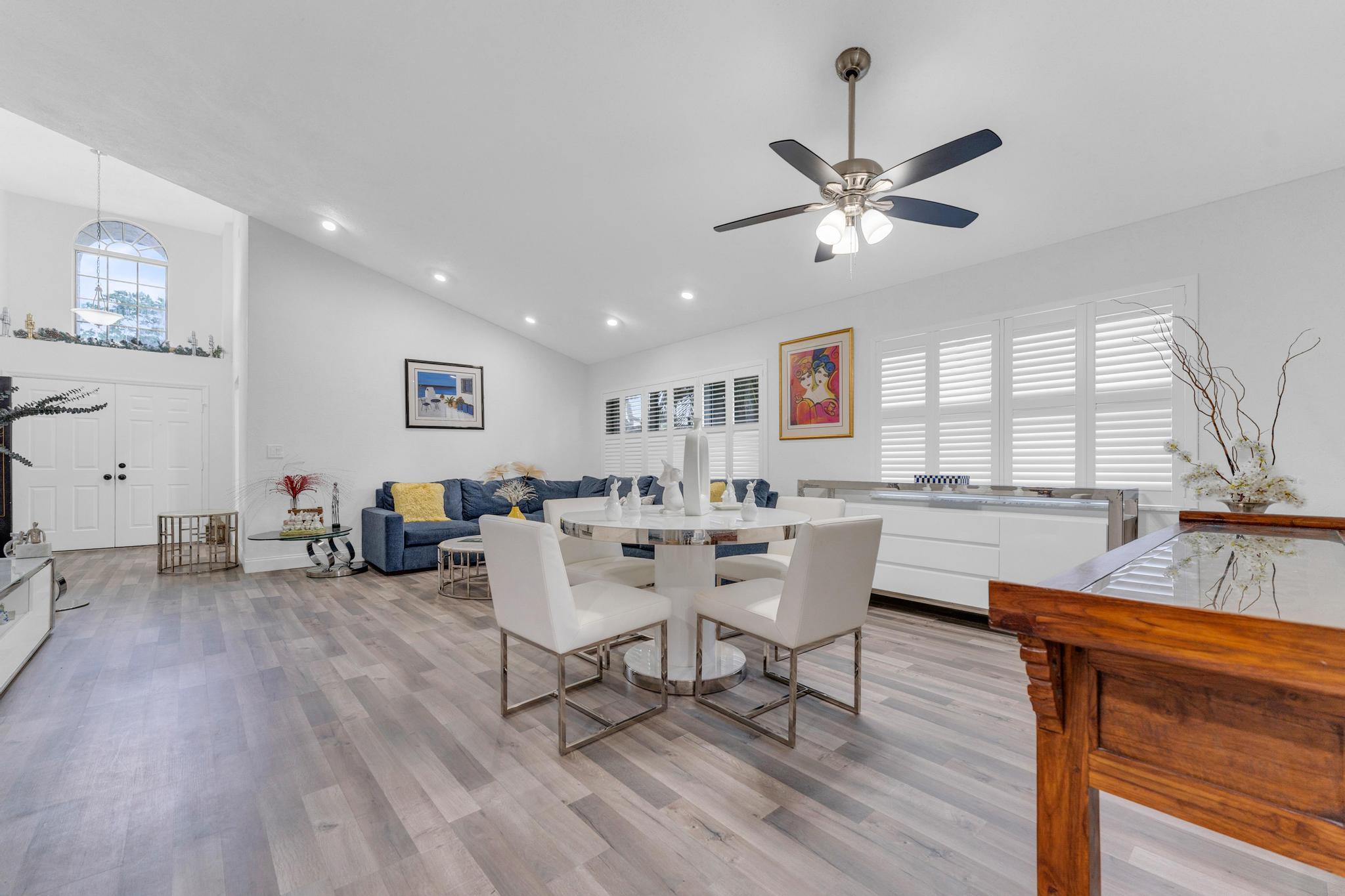 11120 Sangria Court Boca Raton, FL 33498 - Photo 25 of 34 a view of a dining room with furniture window and wooden floor
