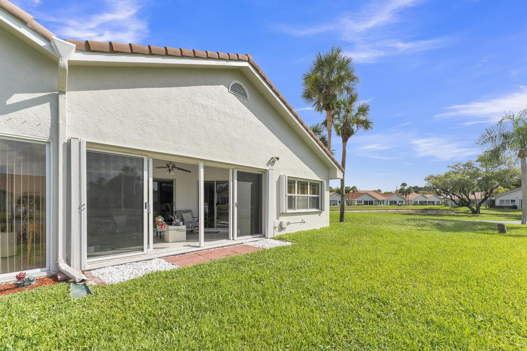 11120 Sangria Court Boca Raton, FL 33498 - Photo 33 of 34 a view of a house with a yard