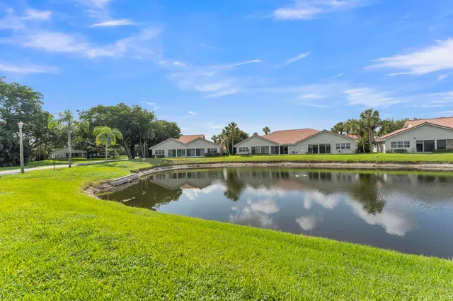 a view of a lake with houses in the background