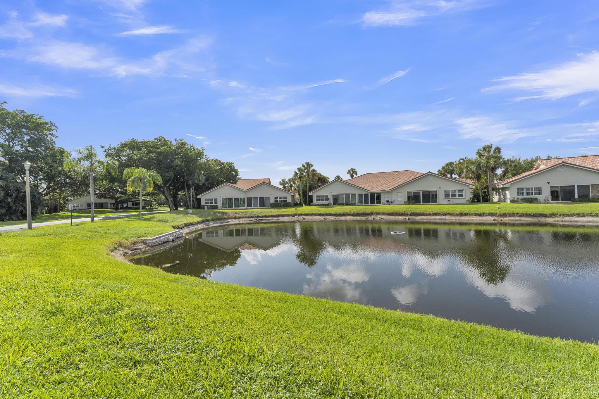 11120 Sangria Court Boca Raton, FL 33498 - Photo 34 of 34 a view of a lake with houses in the background