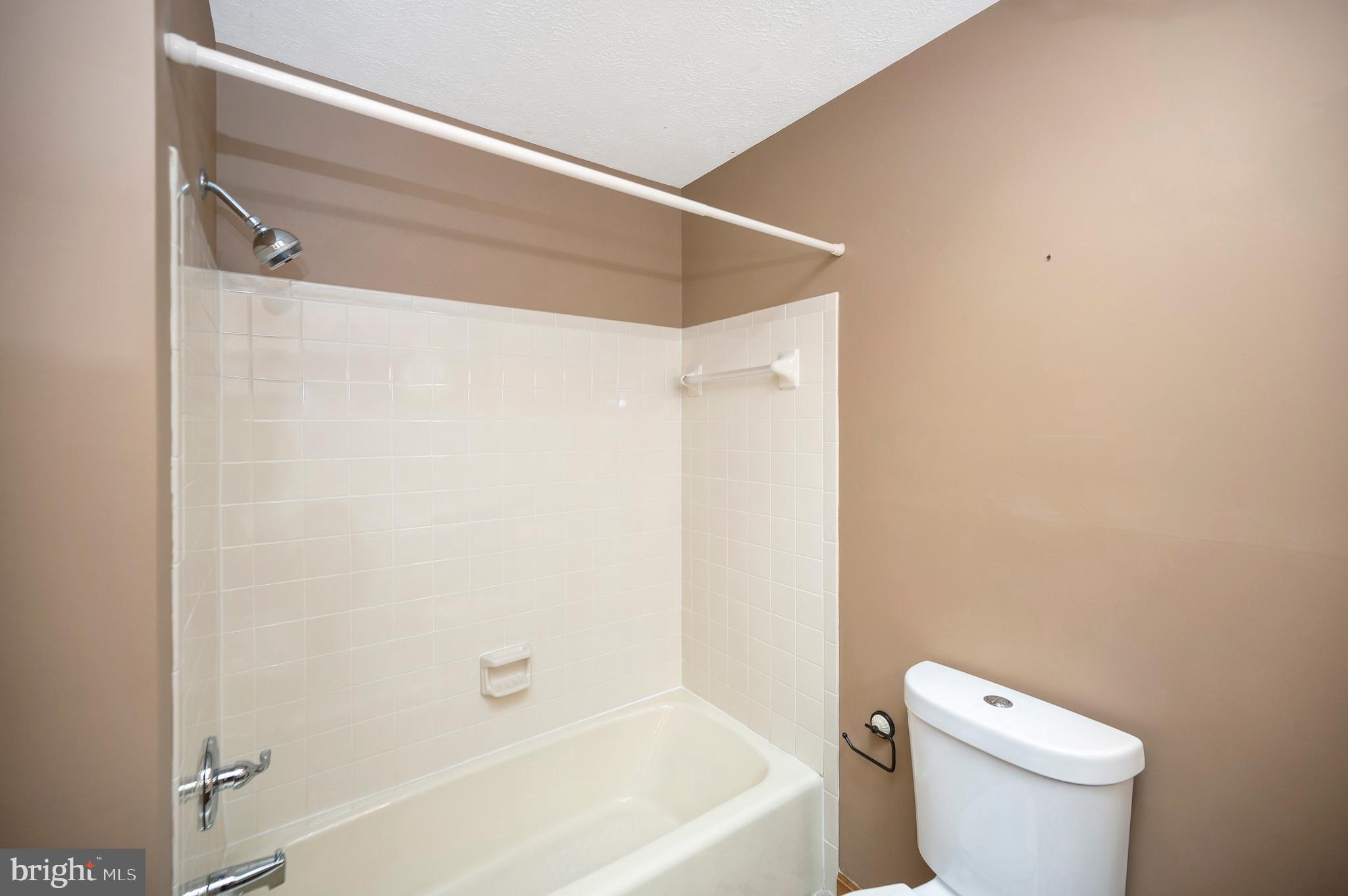 204 Freedom Road Locust Grove, VA 22508 - Photo 20 of 42 a white toilet sitting next to a bath tub