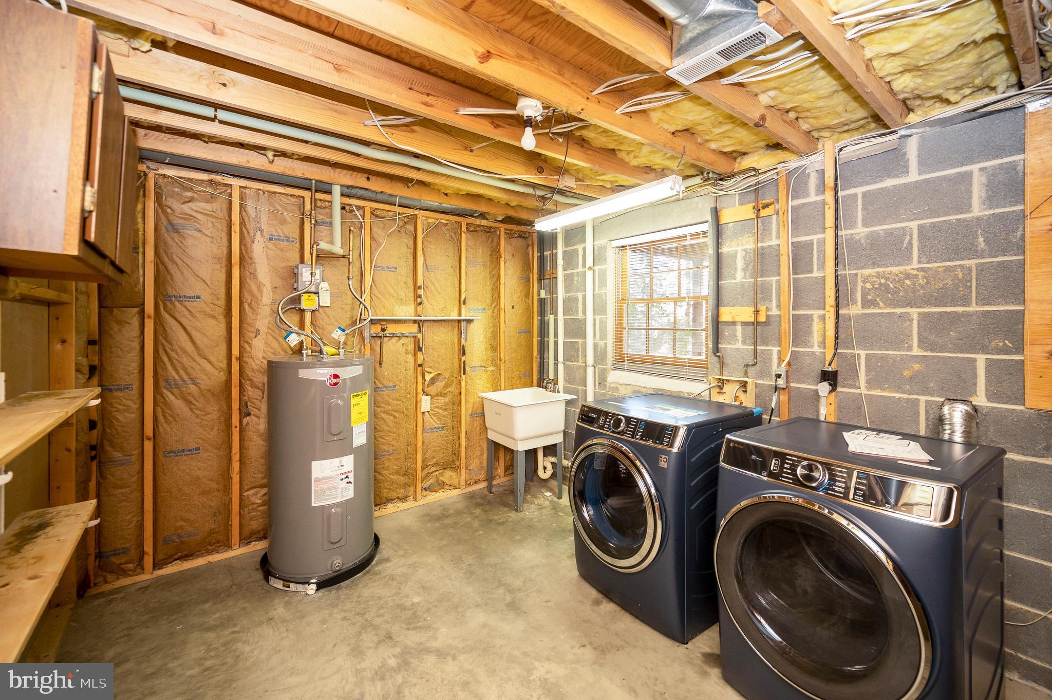 204 Freedom Road Locust Grove, VA 22508 - Photo 25 of 42 a view of a storage & utility room with dryer and washer