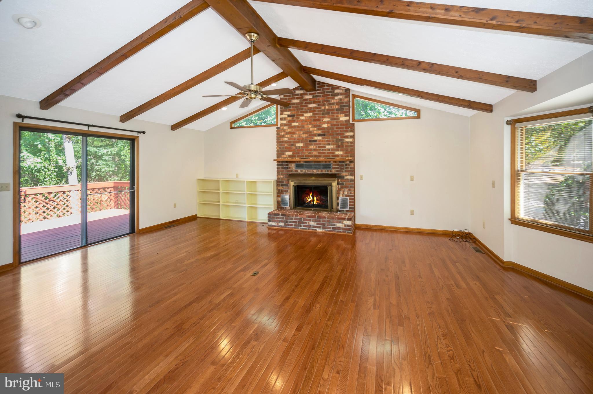 204 Freedom Road Locust Grove, VA 22508 - Photo 6 of 42 a view of empty room with wooden floor and fireplace
