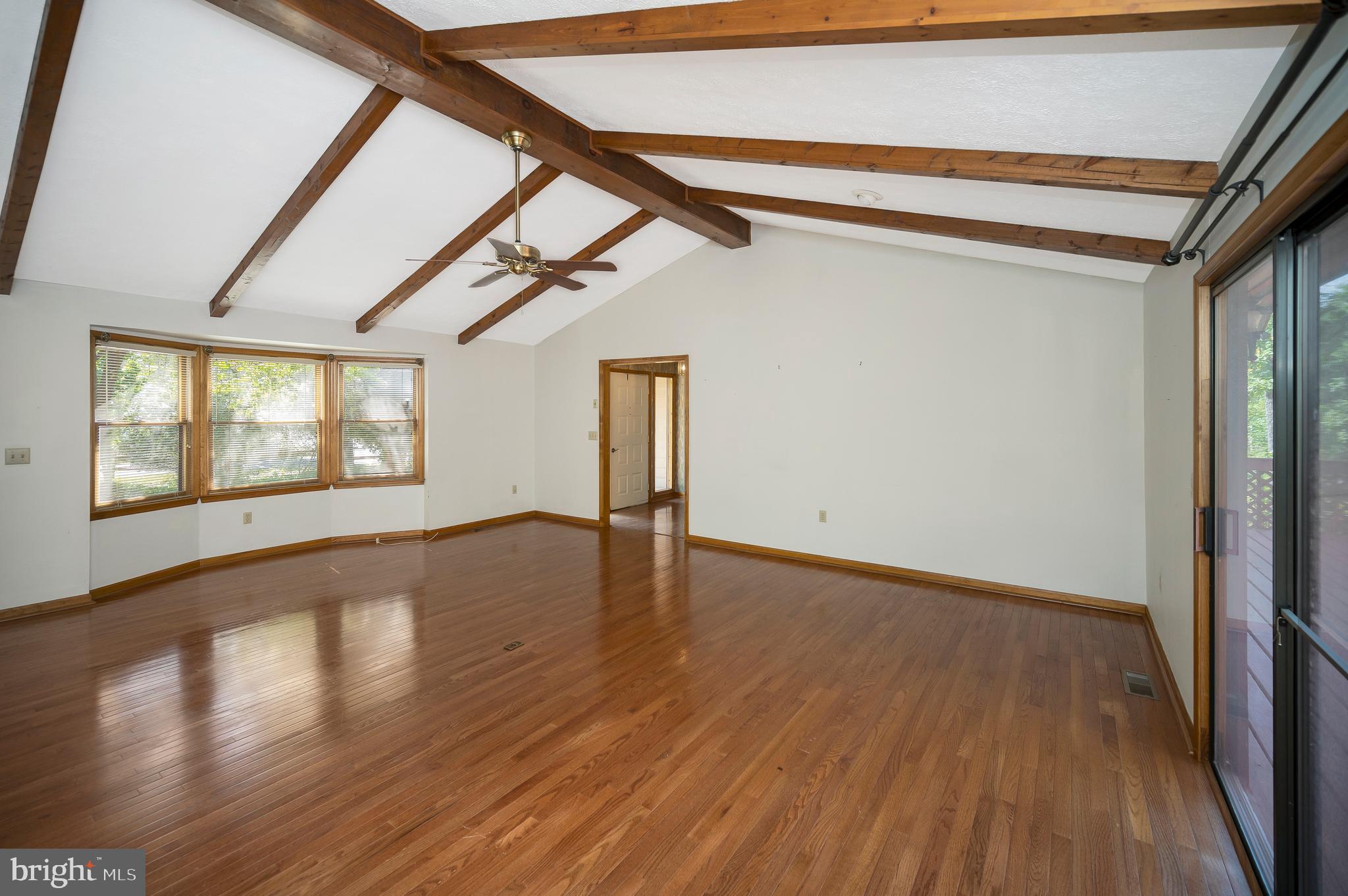204 Freedom Road Locust Grove, VA 22508 - Photo 7 of 42 a view of an empty room with wooden floor and a window