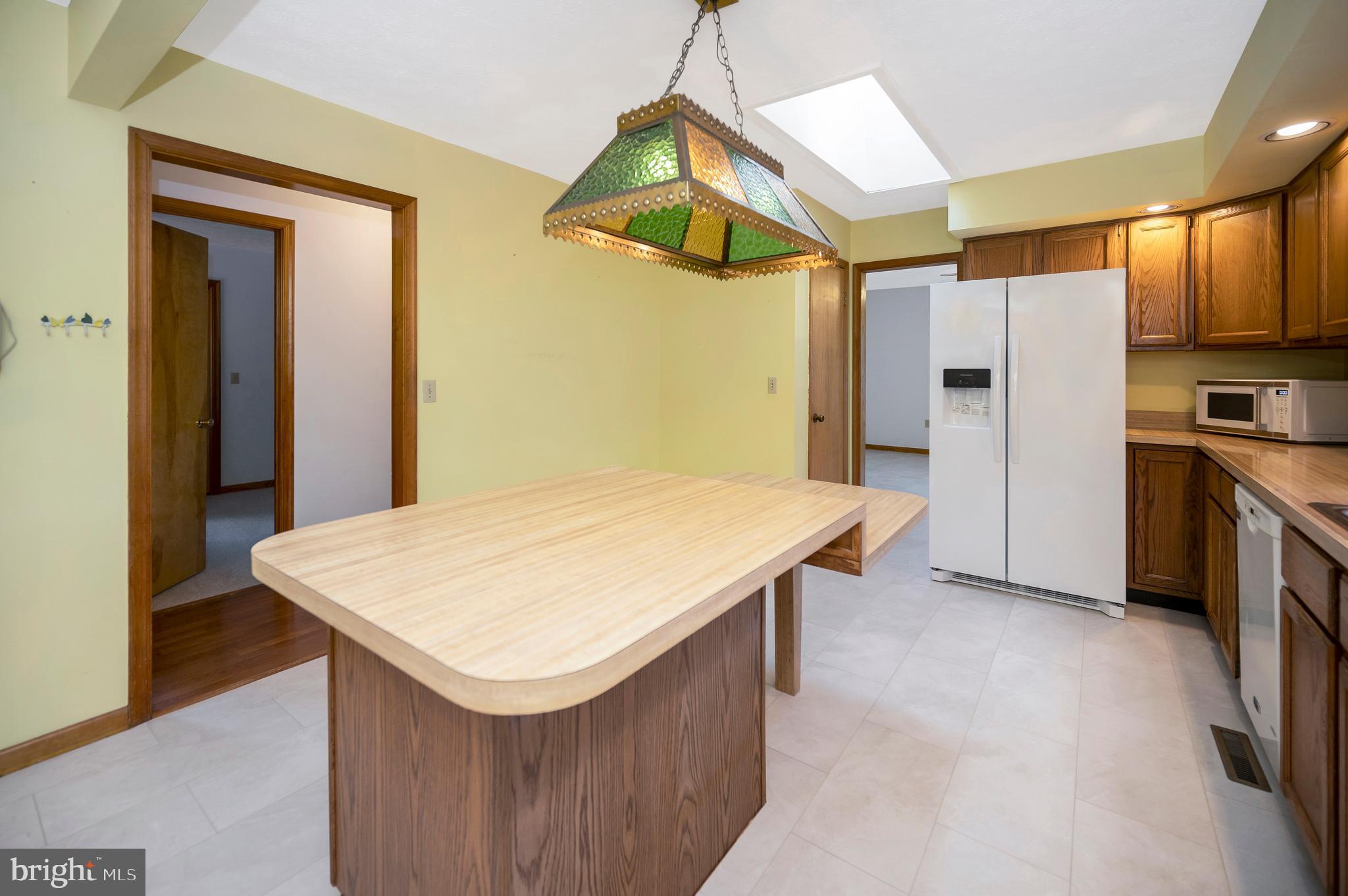 204 Freedom Road Locust Grove, VA 22508 - Photo 10 of 42 a kitchen with stainless steel appliances a refrigerator and a stove top oven