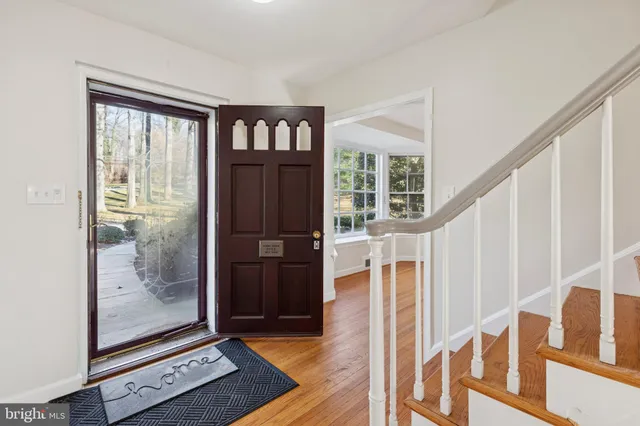 a view of an entryway with wooden floor