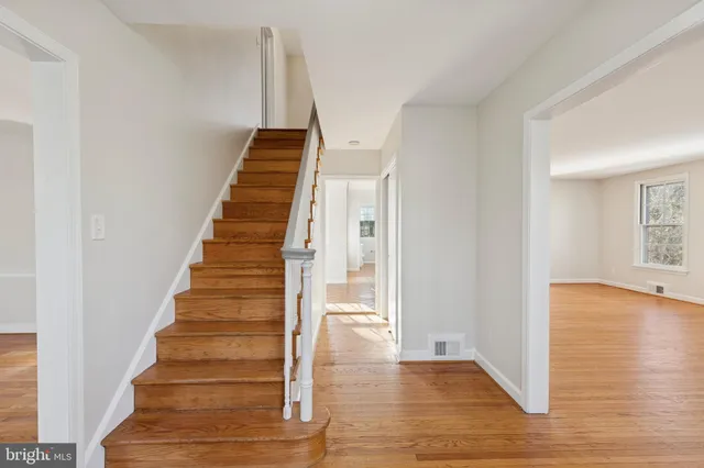 a view of an entryway with wooden floor