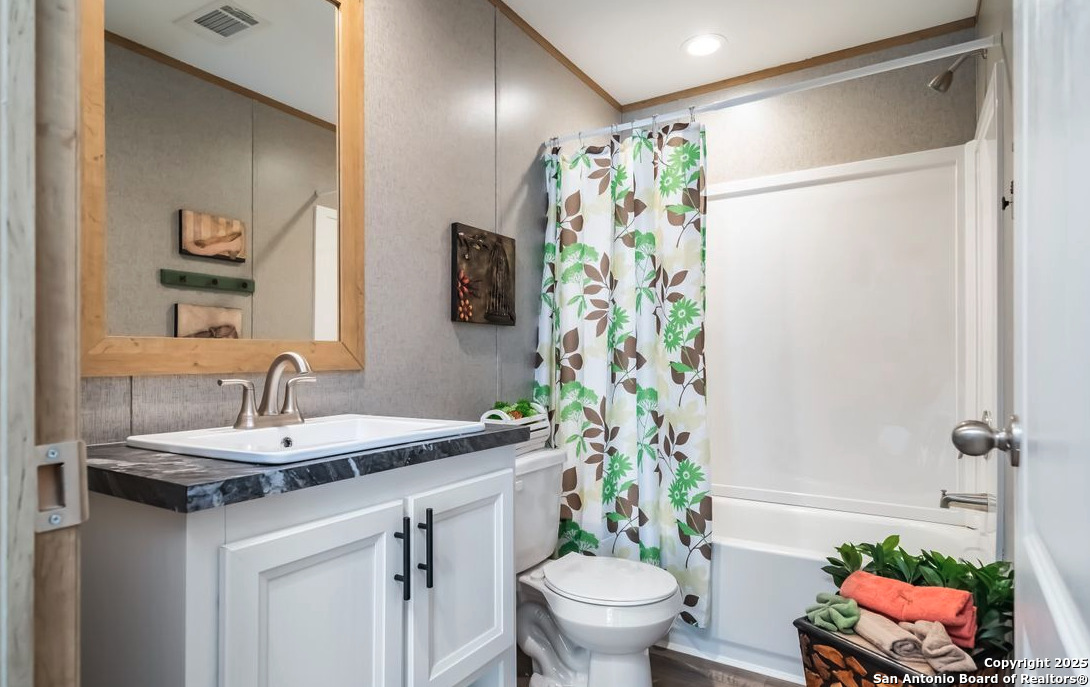 4124 Wegner Road New Braunfels, TX 78132 - Photo 12 of 12 a bathroom with a sink toilet and shower