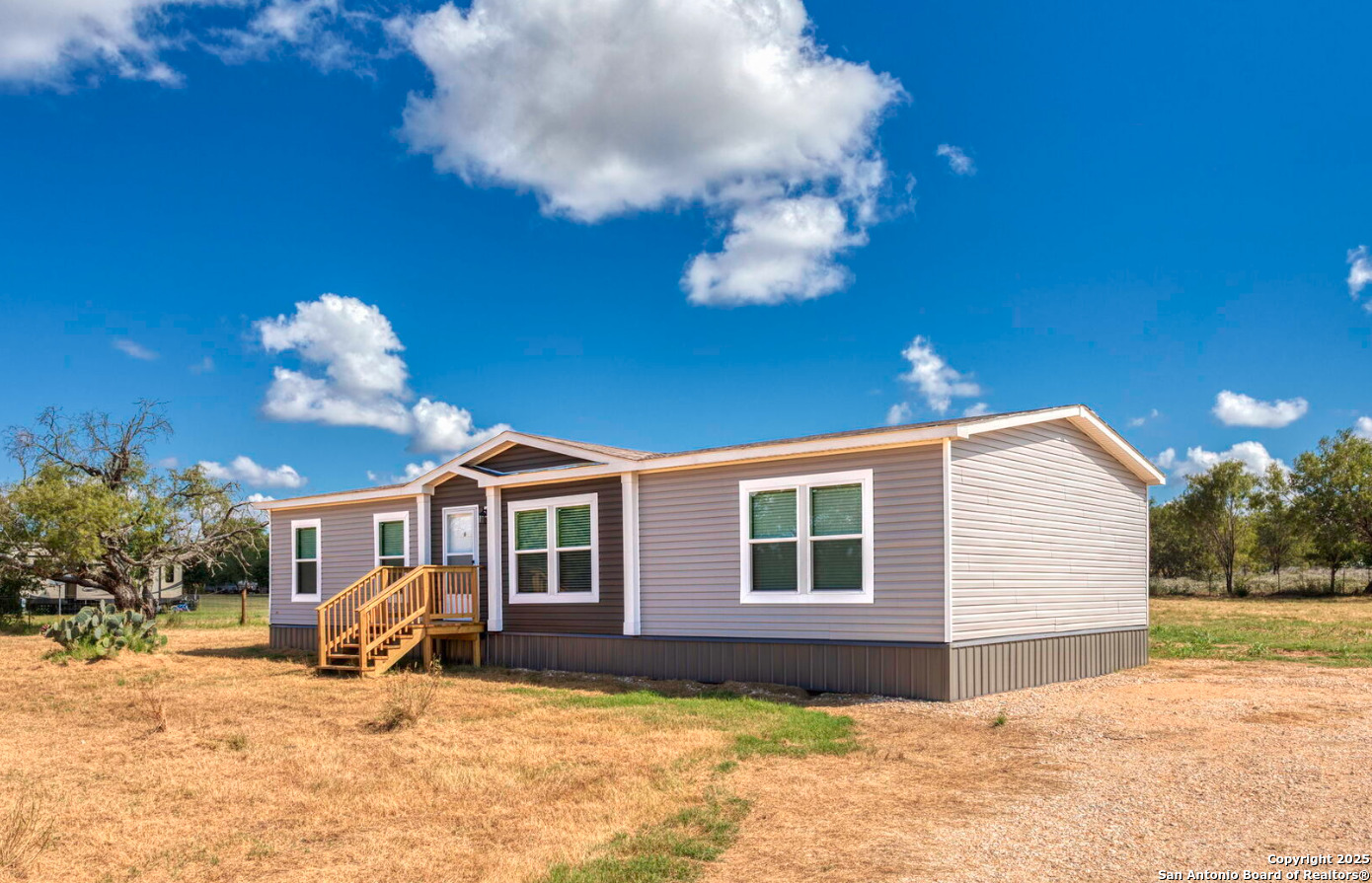 4124 Wegner Road New Braunfels, TX 78132 - Photo 2 of 12 a view of a house with a yard