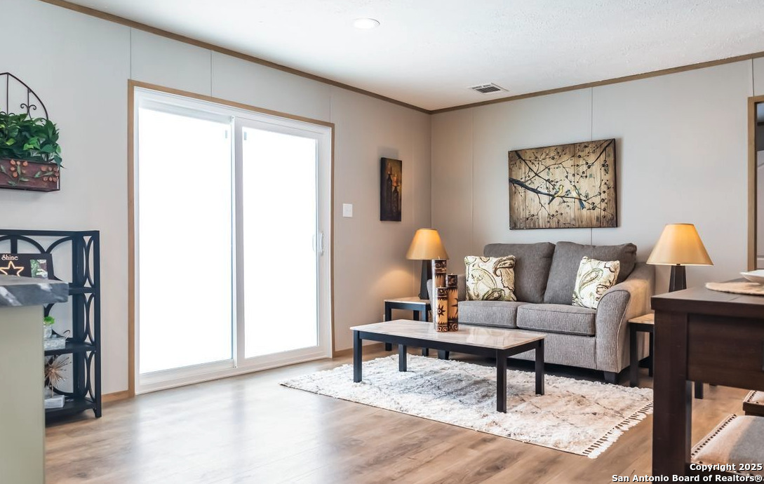 4124 Wegner Road New Braunfels, TX 78132 - Photo 6 of 12 a living room with furniture and a window