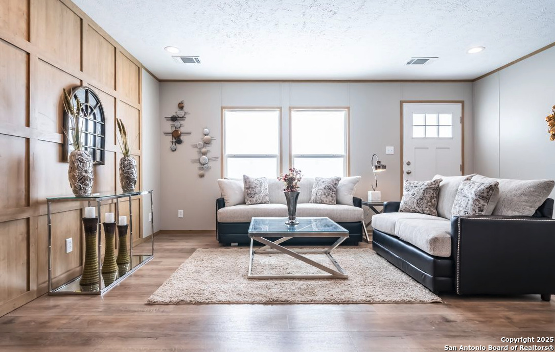 4124 Wegner Road New Braunfels, TX 78132 - Photo 9 of 12 a living room with furniture and a rug