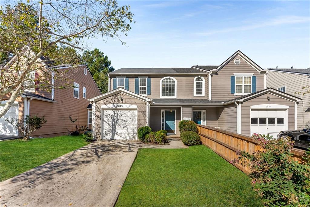 5845 Hampton Court Atlanta, GA 30349 - Photo 1 of 1 a front view of a house with yard