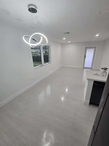 a view of a room with windows