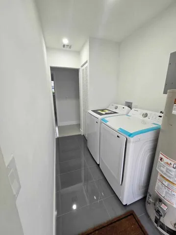 a utility room with washer and dryer
