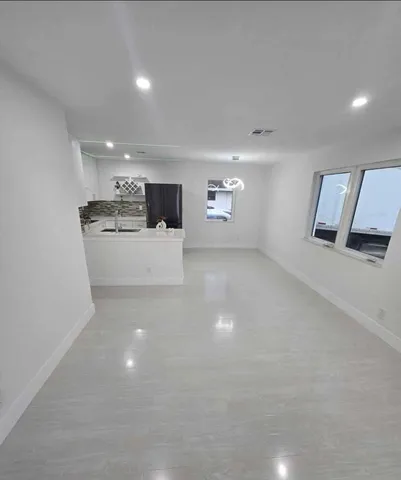 a view of a kitchen with a sink and dishwasher
