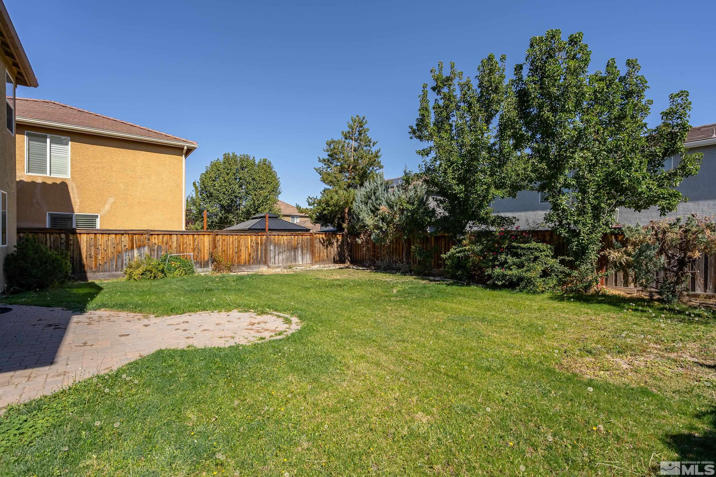 11290 Messina Way Reno, NV 89521 - Photo 17 of 26 a view of a backyard with a garden
