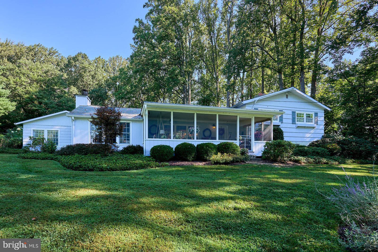 31 Haviland Mill Road Brinklow, MD 20862 - Photo 2 of 36 a front view of a house with a yard and garage