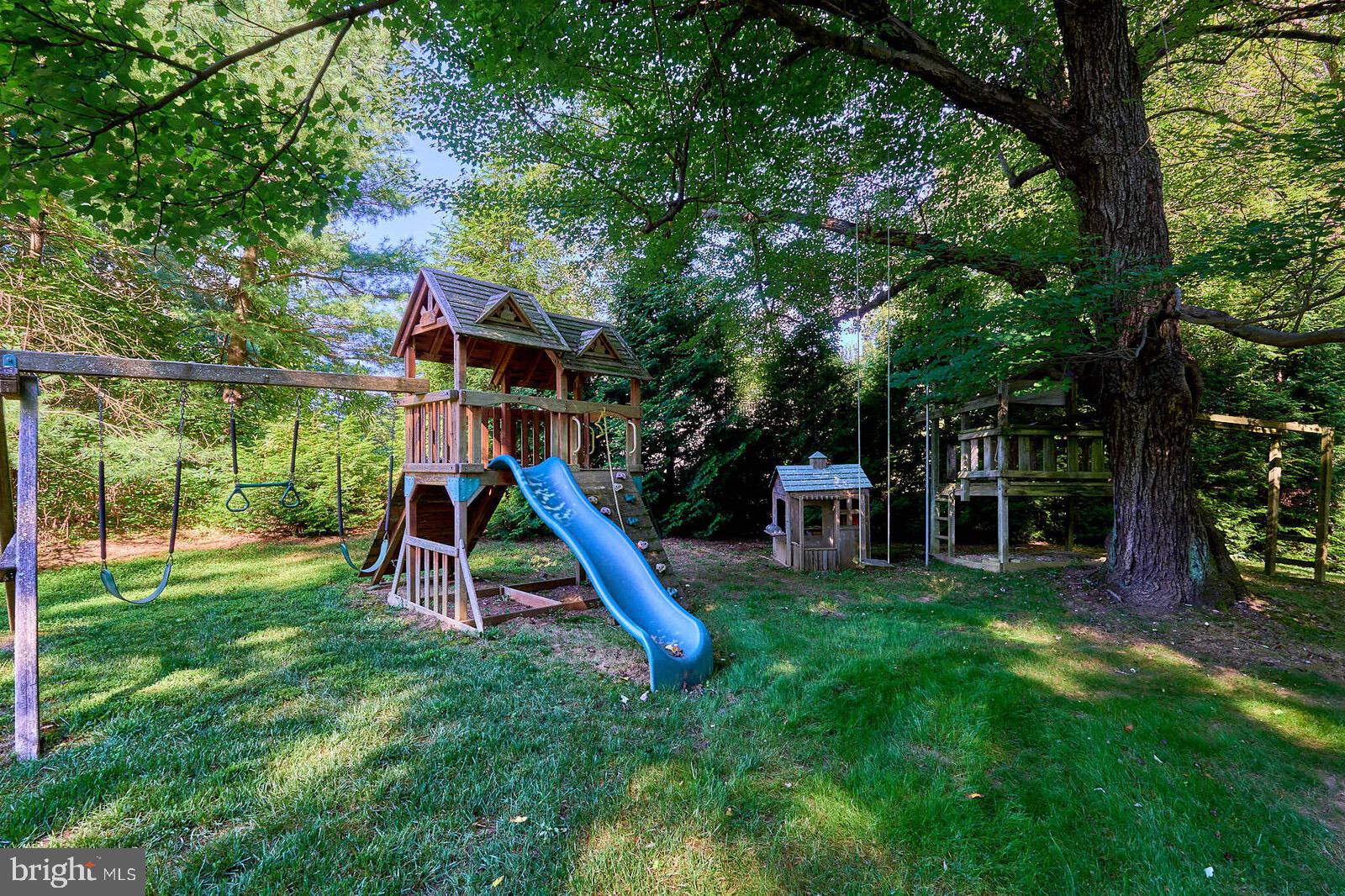 31 Haviland Mill Road Brinklow, MD 20862 - Photo 30 of 36 a view of a house with a backyard and a slide