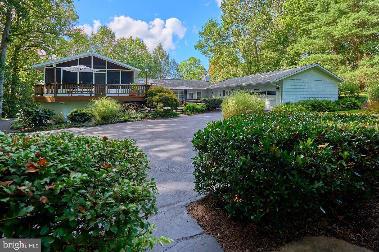 31 Haviland Mill Road Brinklow, MD 20862 - Photo 3 of 36 a front view of a house with a yard and potted plants