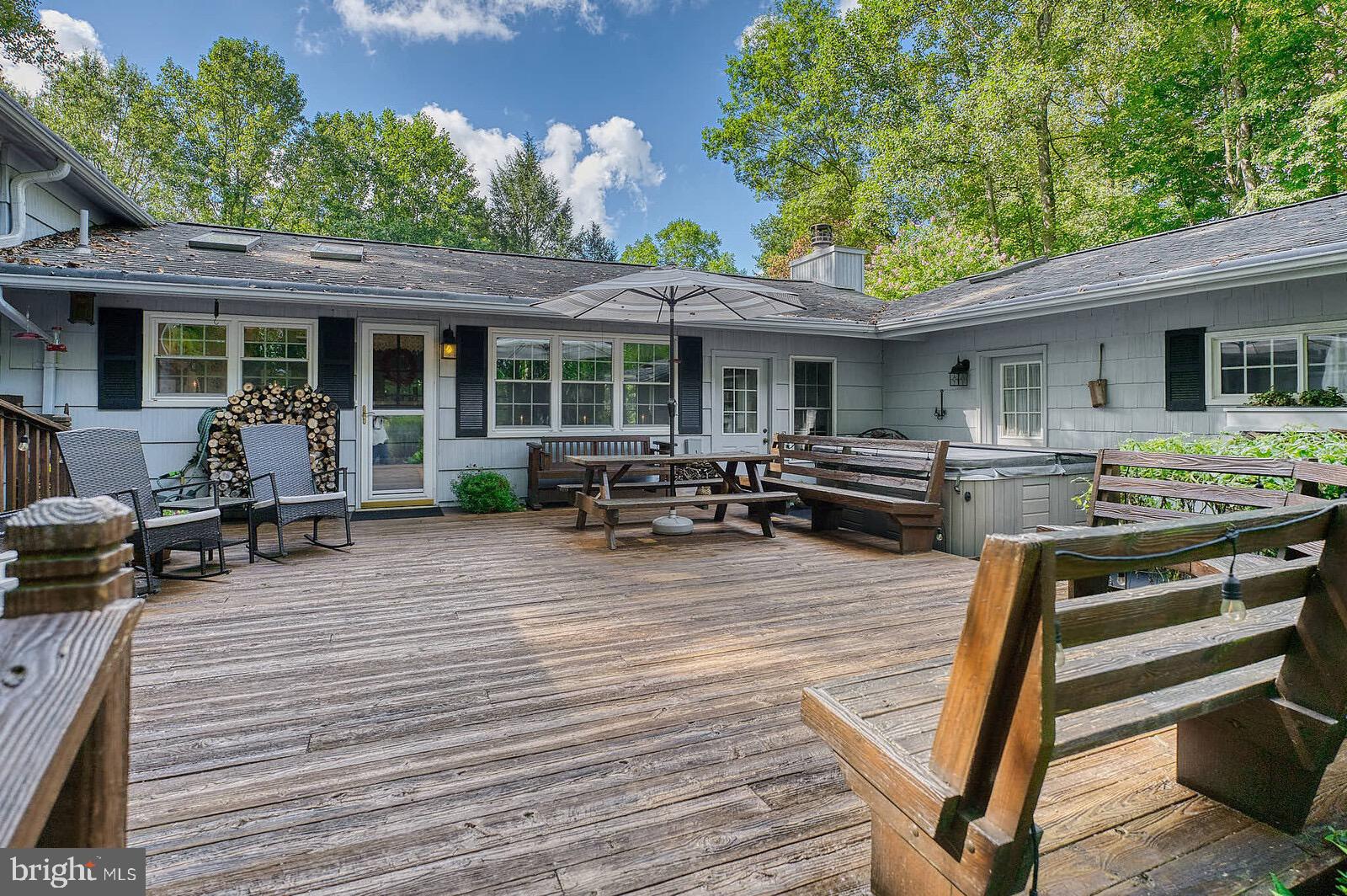 31 Haviland Mill Road Brinklow, MD 20862 - Photo 36 of 36 a view of a patio with table and chairs barbeque potted plants and large tree
