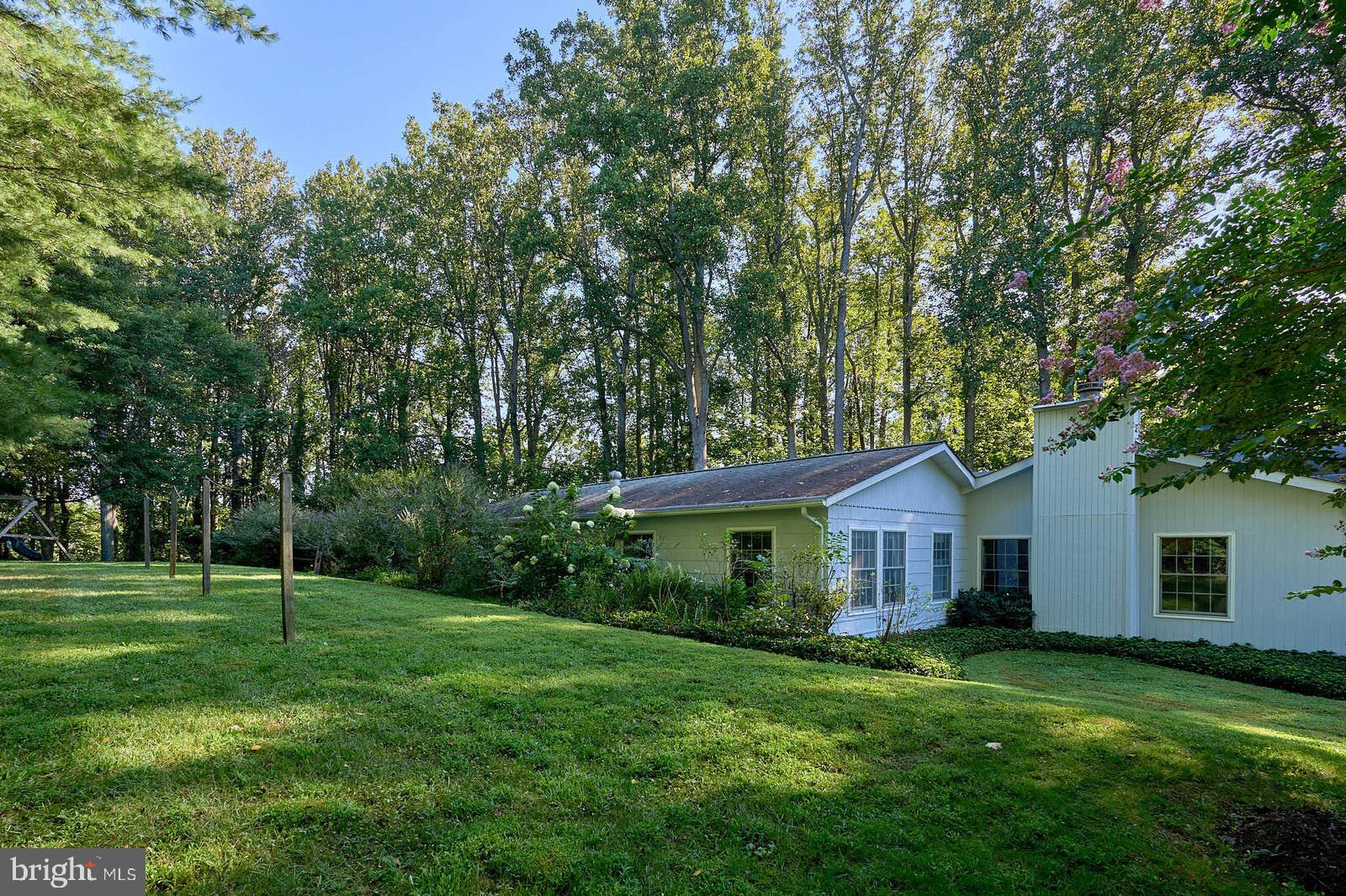 31 Haviland Mill Road Brinklow, MD 20862 - Photo 7 of 36 a front view of a house with a garden