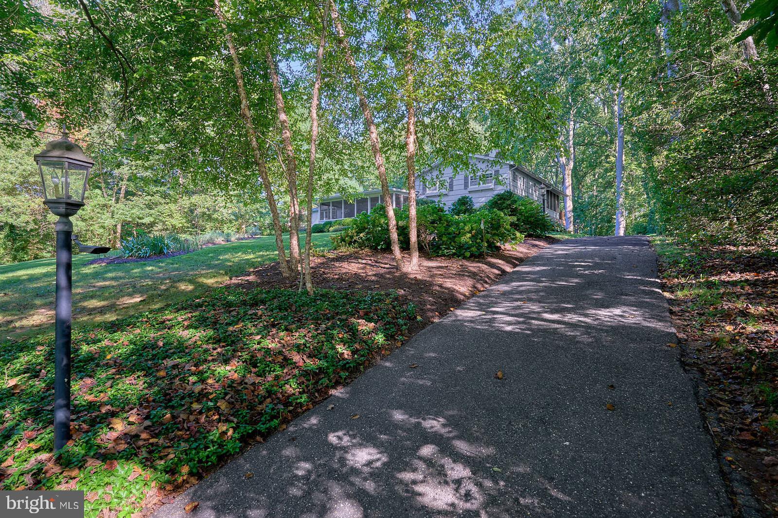 31 Haviland Mill Road Brinklow, MD 20862 - Photo 9 of 36 a view of a street with trees and bushes