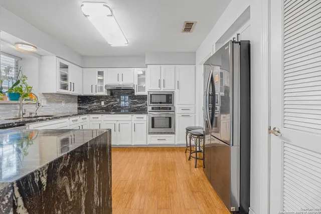 a view of room with a ceiling fan and window